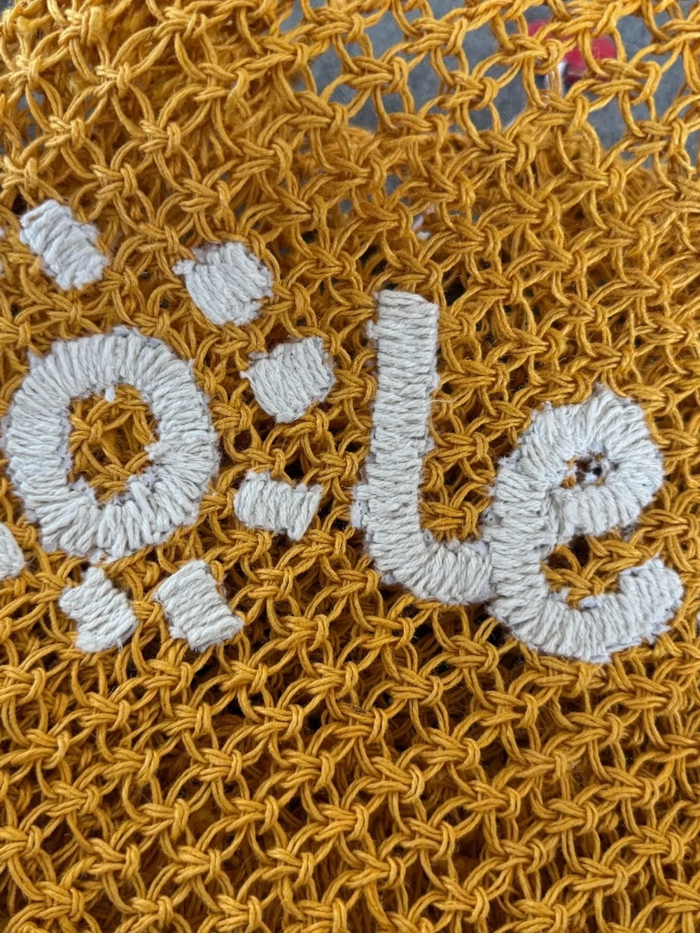 NWOT, RAFFIA WOVEN TOTE WITH DARLING “SOLEIL”